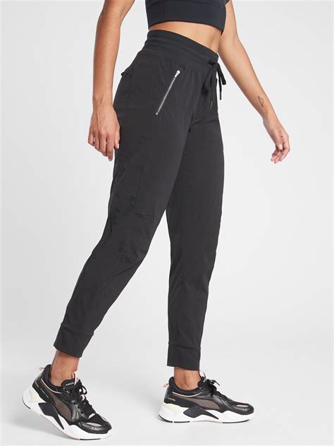 Athleta trekkie north jogger - Shop Athleta's Trekkie North Jogger: FOR: Hike, long distance, short distance, and trail running, FEEL: Sleek, lightweight Ripstop has 2-way stretch for extra mobility, FAVE: New high-rise fit with a Powervita waistband for gentle compression, Updated zipper details and tapered hem, Front zip pockets and a side cargo pocket holds your essentials, #533655